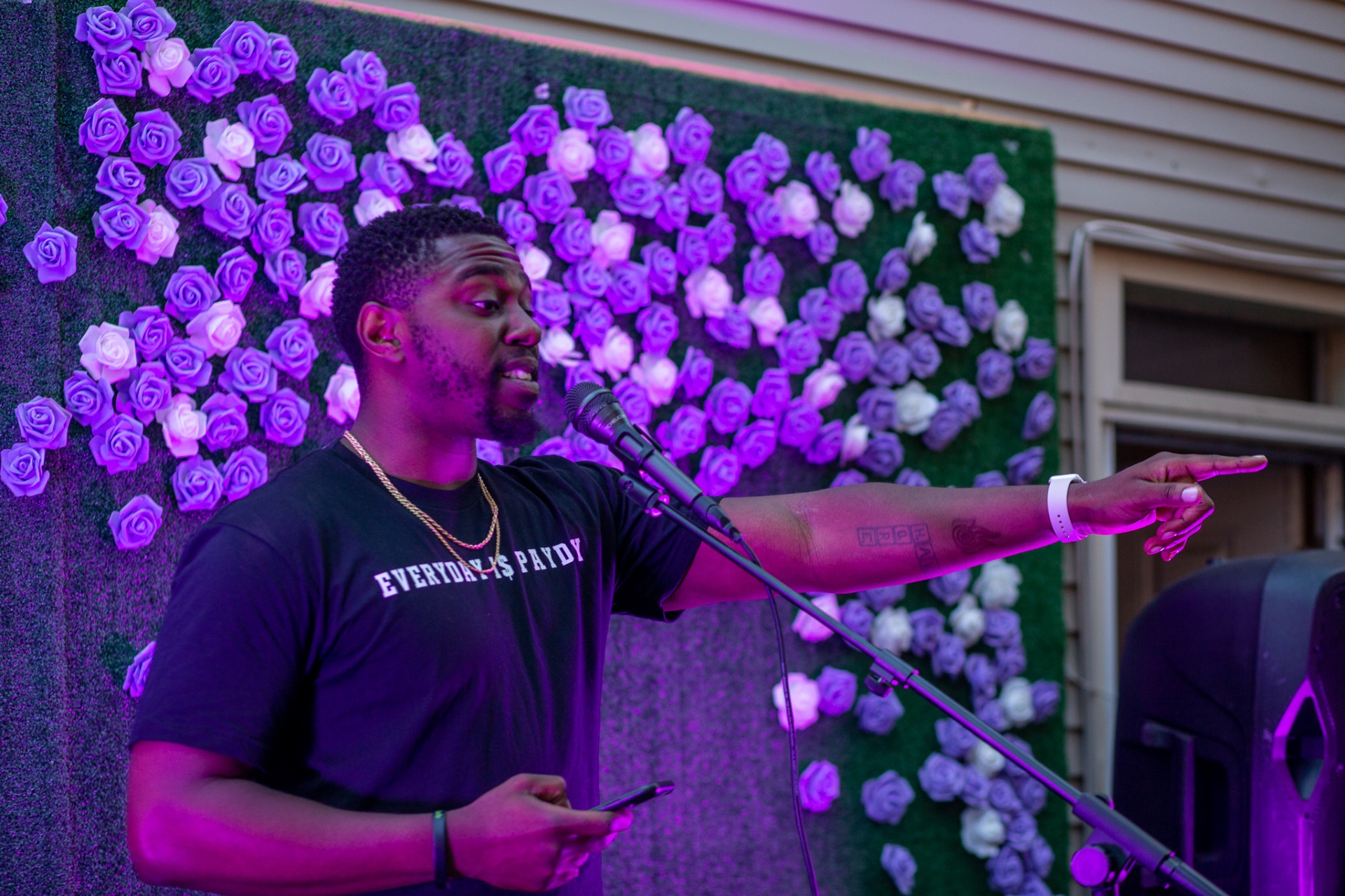 Host pointing to the crowd at Hues Cookout 2022